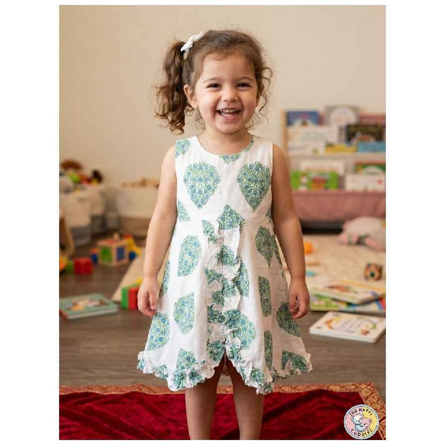 Ruffled edges along the center and the hem add a soft