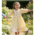 Trendy puff sleeves (3/4) with ruffled cuffs.