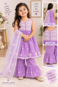 A young girl modeling a lavender purple traditional Indian outfit with white floral embroidery, featuring a sleeveless top, flared pants, and a matching dupatta. The image includes front, back, and detail inset views on the right, with decorative text overlays and a soft indoor background.